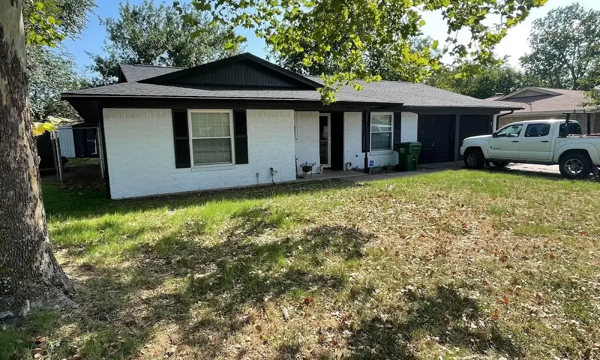 Professional roofing crew working on a residential roof in North Bay Village